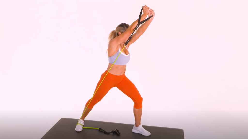 Woman doing Standing Band Woodchoppers