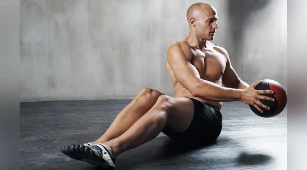 Man doing Medicine Ball Russian Twists