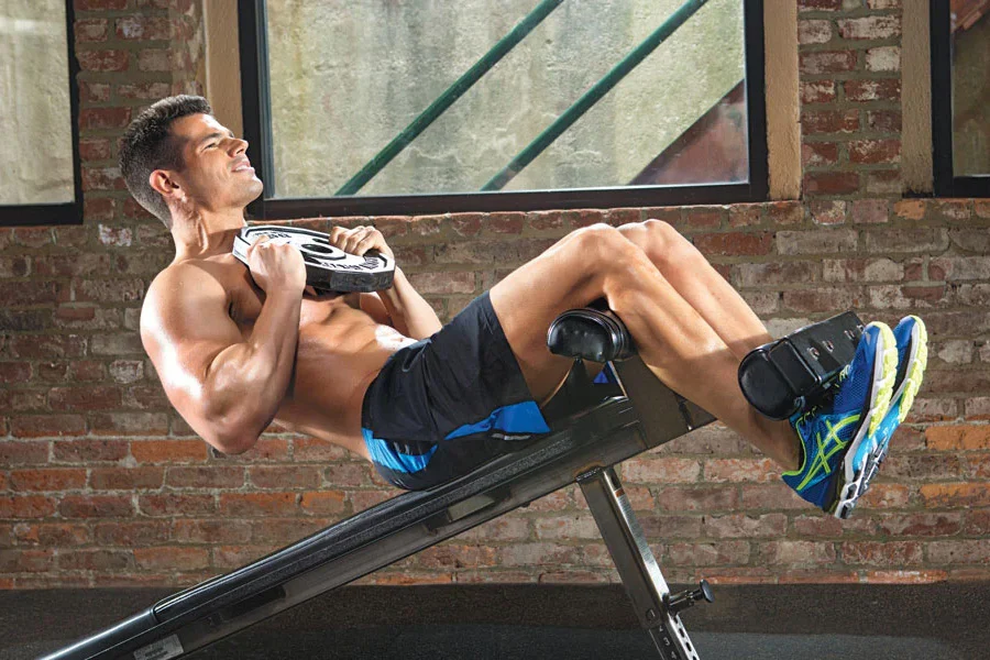 man doing Weighted Sit-ups on Decline Bench