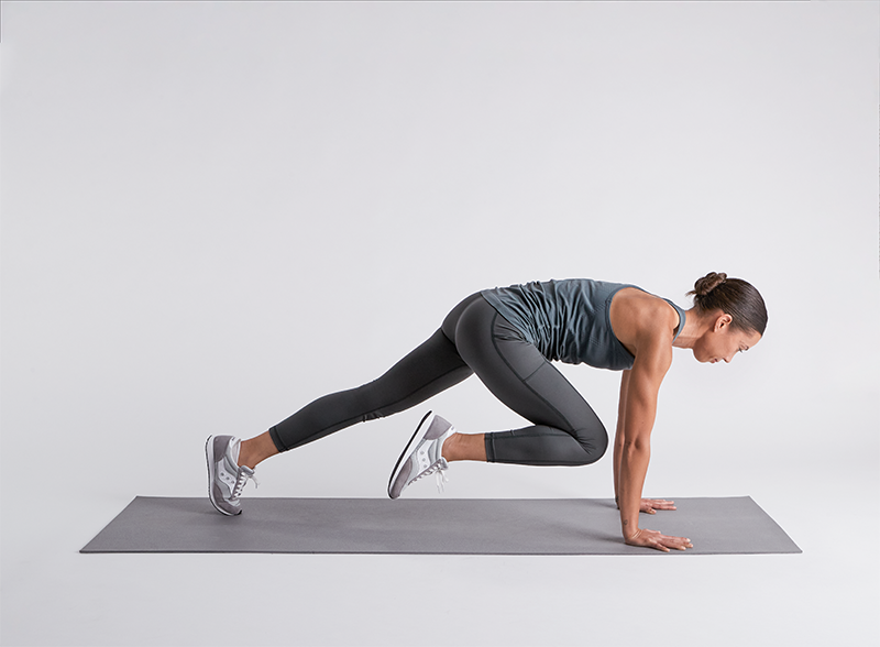 Woman doing mountain climbers 2